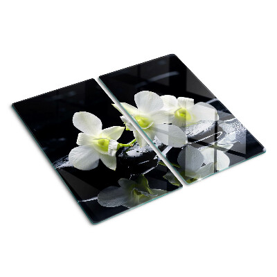 Schneidebrett glas Orchideen auf schwarzem Hintergrund