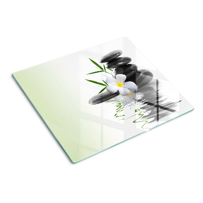 Schneidebrett glas Blumen und Steine auf dem Wasser