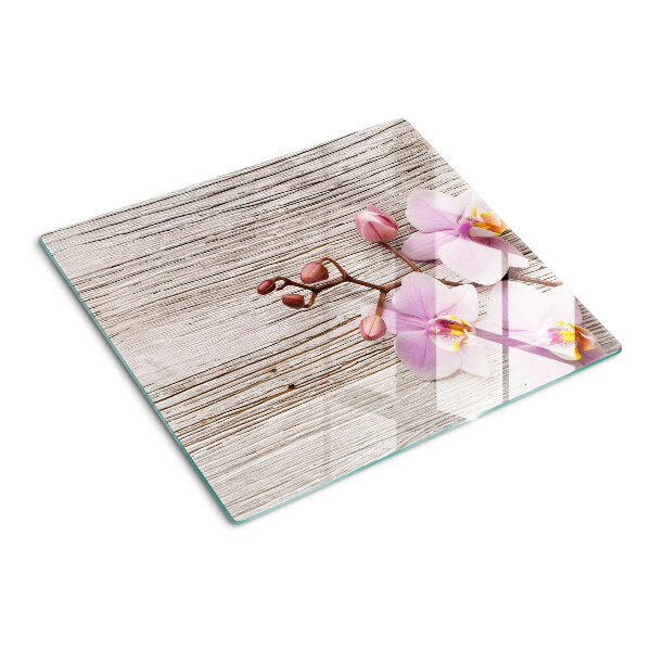 Schneidebrett glas Orchideen auf einem Holzhintergrund