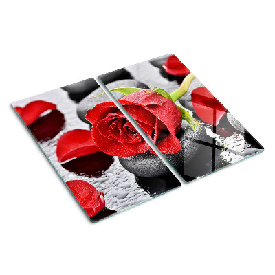Glasschneidebrett Rose auf Steinen mit Wassertropfen