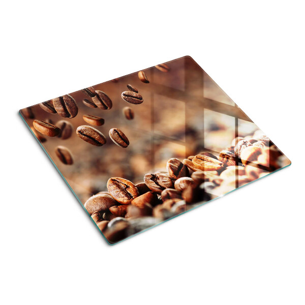 Glasschneidebrett Kaffeebohnen in Bewegung
