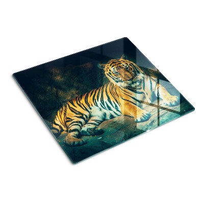 Glasschneidebrett Tiger liegt auf den Felsen