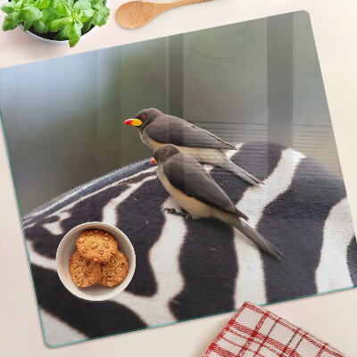 Glasschneidebrett Vögel auf einem Zebra