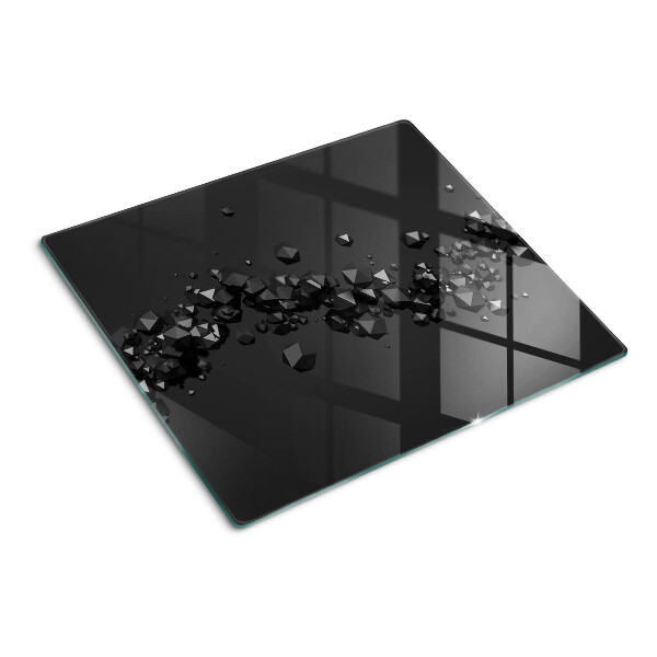 Glasschneidebrett Schwarze Kristalle auf dem Hintergrund