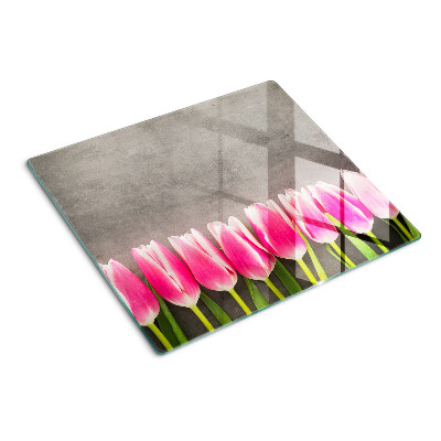 Schneidebrett glas Tulpen auf grauem Hintergrund