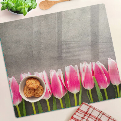 Schneidebrett glas Tulpen auf grauem Hintergrund