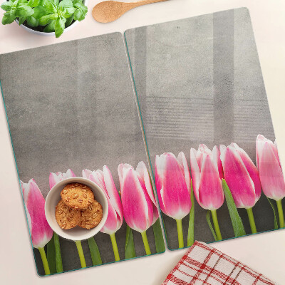 Schneidebrett glas Tulpen auf grauem Hintergrund
