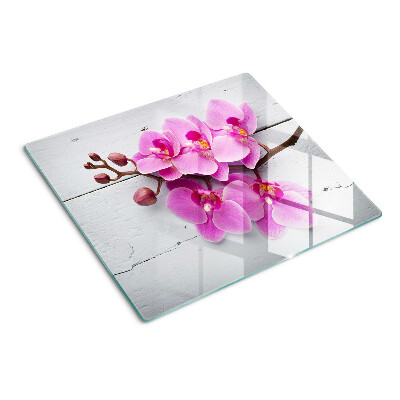 Schneidebrett glas Orchideen auf weißem Hintergrund
