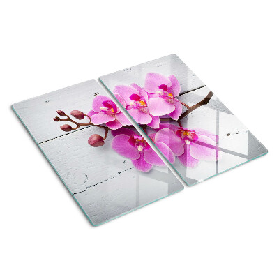 Schneidebrett glas Orchideen auf weißem Hintergrund