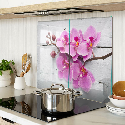 Schneidebrett glas Orchideen auf weißem Hintergrund