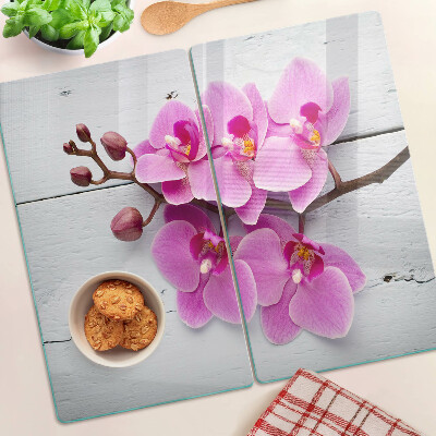 Schneidebrett glas Orchideen auf weißem Hintergrund