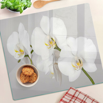 Schneidebrett glas Orchideen auf einem Spiegelhintergrund