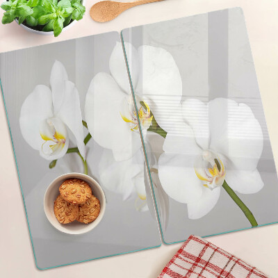 Schneidebrett glas Orchideen auf einem Spiegelhintergrund