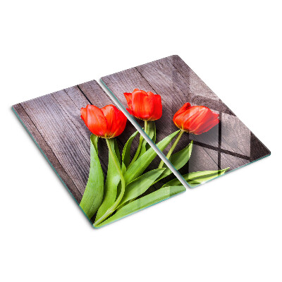 Schneidebrett glas Tulpen auf einem hölzernen Hintergrund