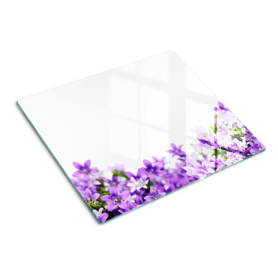 Glasschneidebrett Lila Blumen im Hintergrund