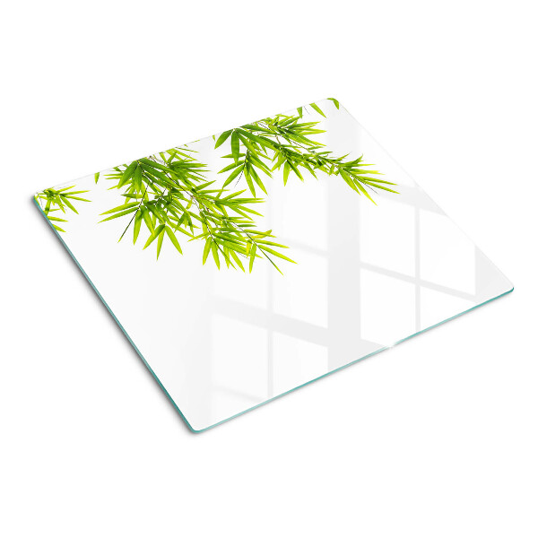 Schneidebrett glas Bambusblätter auf dem Fensterhintergrund