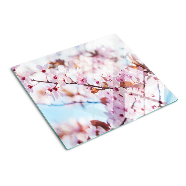 Glasschneidebrett Kirschblüten auf blauem Hintergrund