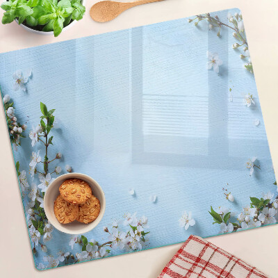 Schneidebrett glas Blumenmuster auf blauem Hintergrund