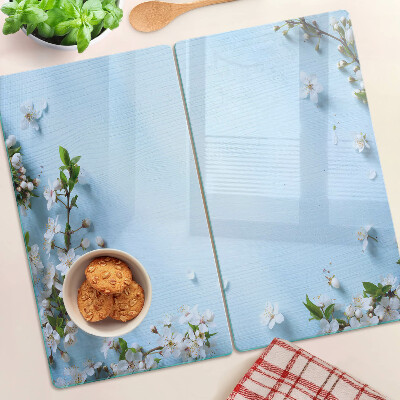 Schneidebrett glas Blumenmuster auf blauem Hintergrund