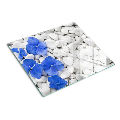 Schneidebrett glas Blaue Blumen auf weißen Steinen