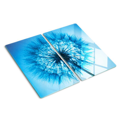 Schneidebrett glas Löwenzahn auf blauem Hintergrund