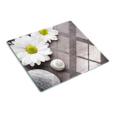 Schneidebrett glas Blumen und Steine auf dem Hintergrund