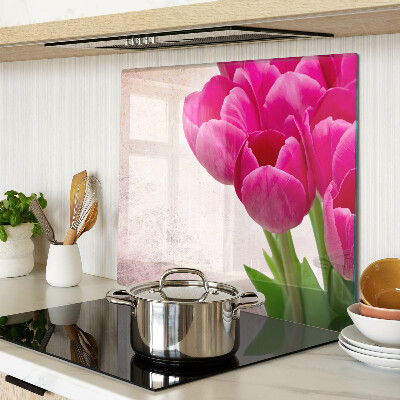 Glasschneidebrett Tulpenblüten auf rosa Hintergrund