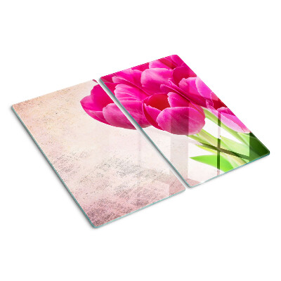 Glasschneidebrett Tulpenblüten auf rosa Hintergrund