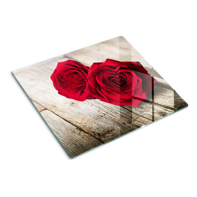Glasschneidebrett Rote Rosen auf einem hölzernen Hintergrund
