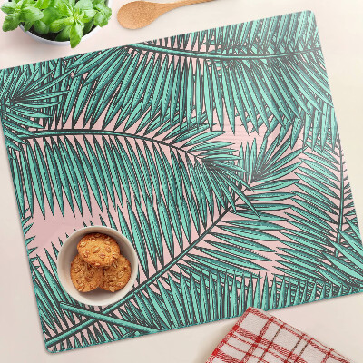 Glasschneidebrett Palmblätter auf rosa Hintergrund