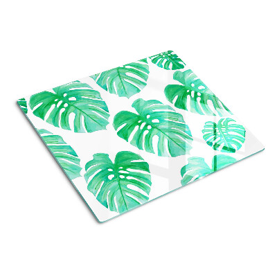 Glasschneidebrett Monstera-Blätter auf weißem Hintergrund