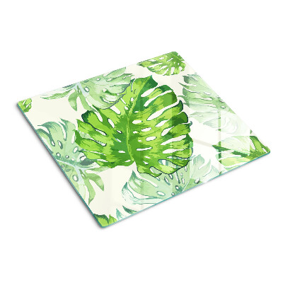 Glasschneidebrett Monstera-Blätter auf hellem Hintergrund