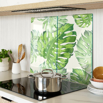 Glasschneidebrett Monstera-Blätter auf hellem Hintergrund