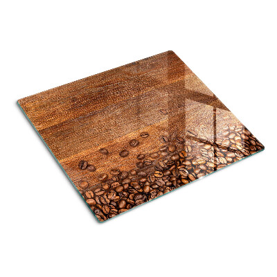 Schneidebrett glas Kaffeebohnen auf Holzhintergrund