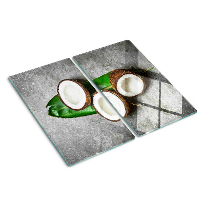 Glasschneidebrett Kokosnuss auf konkretem Hintergrund