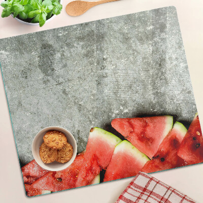Glasschneidebrett Wassermelonenscheiben auf grauem Hintergrund