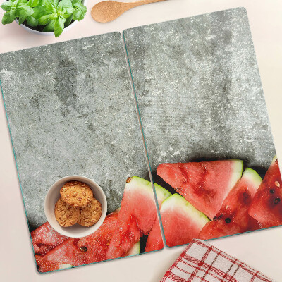 Glasschneidebrett Wassermelonenscheiben auf grauem Hintergrund