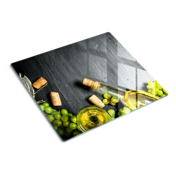 Schneidebrett glas Wein und Trauben