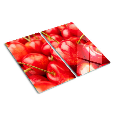 Glasschneidebrett Kirschen auf rotem Hintergrund