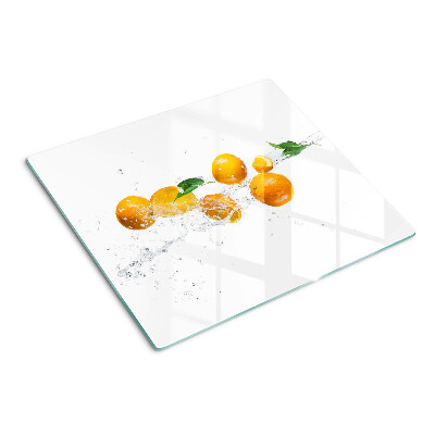 Schneidebrett glas Zitrusfrüchte mit Wasser