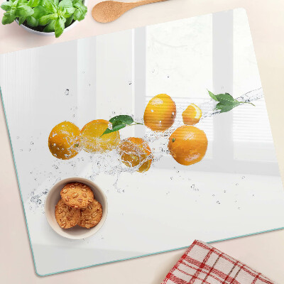 Schneidebrett glas Zitrusfrüchte mit Wasser