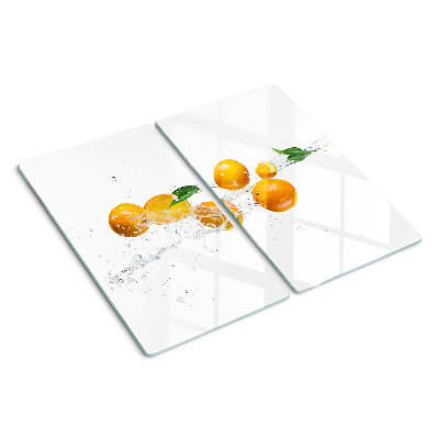 Schneidebrett glas Zitrusfrüchte mit Wasser