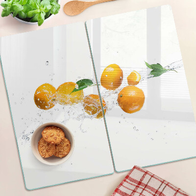 Schneidebrett glas Zitrusfrüchte mit Wasser
