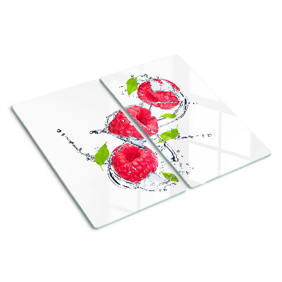 Schneidebrett glas Himbeeren im Wasser mit Blättern