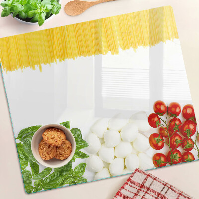 Schneidebrett glas Pasta mit Kräutern und Tomaten