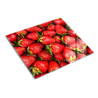 Schneidebrett glas Erdbeeren auf rotem Hintergrund