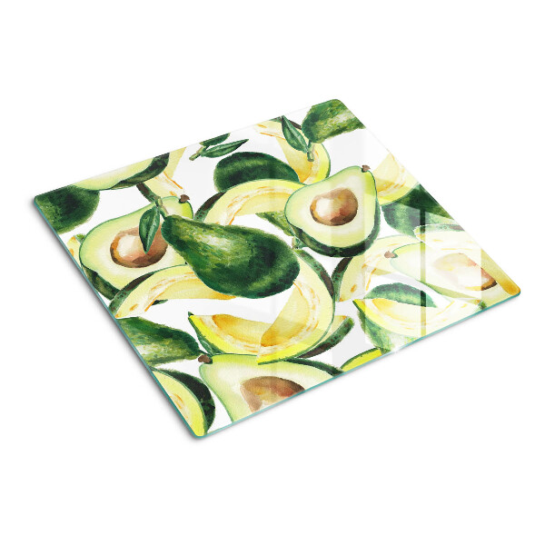 Glasschneidebrett Avocado auf einem Hintergrund aus Blättern