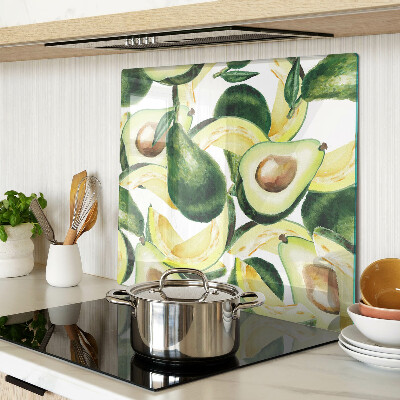 Glasschneidebrett Avocado auf einem Hintergrund aus Blättern