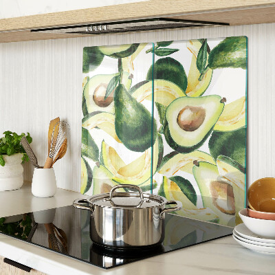 Glasschneidebrett Avocado auf einem Hintergrund aus Blättern