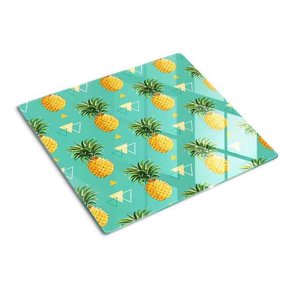 Schneidebrett glas Ananas auf türkisfarbenem Hintergrund